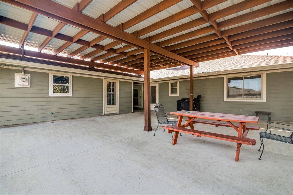 6527 Leasa Court, Sachse, TX 75048 Expansive covered concrete patio.