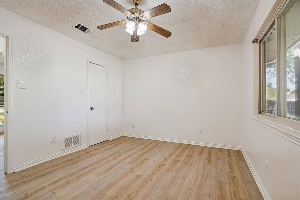 6527 Leasa Court, Sachse, TX 75048 Primary bedroom with backyard views