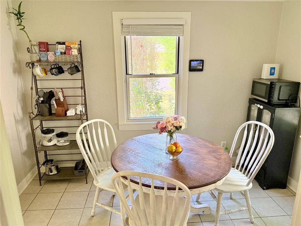 3014 Crestview Street, Tyler, TX 75701 Neutral wall paint, tile flooring, and a window with blinds
