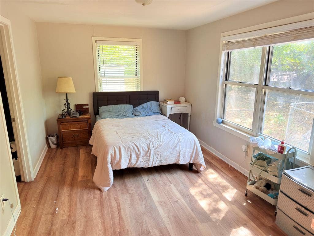 3014 Crestview Street, Tyler, TX 75701 Wood-finish flooring throughout, multiple windows, and neutral wall tones