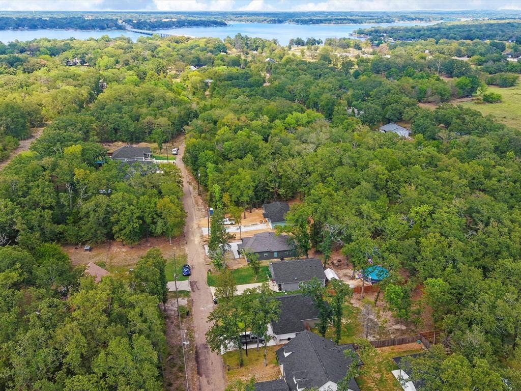 292 Harris Boulevard, Malakoff, TX 75148 Aerial perspective of a residential area with dense tree coverage
