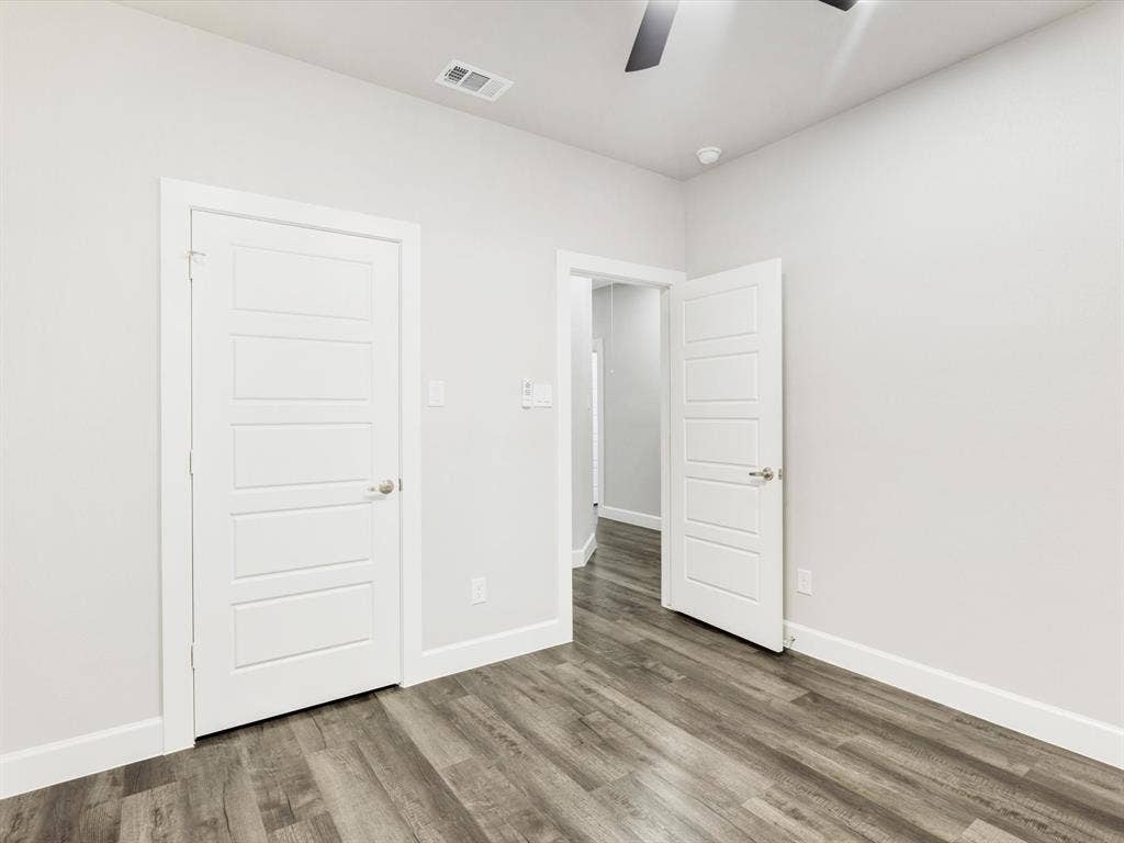 292 Harris Boulevard, Malakoff, TX 75148 Wood-finish flooring throughout, white walls, and modern panel doors