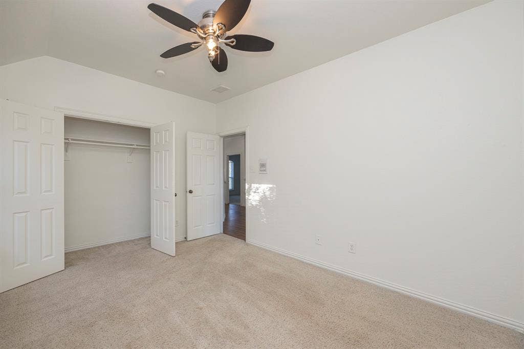 6405 Sapphire Drive, McKinney, TX 75070 Carpeted flooring, vaulted ceiling, and built-in closet with double doors