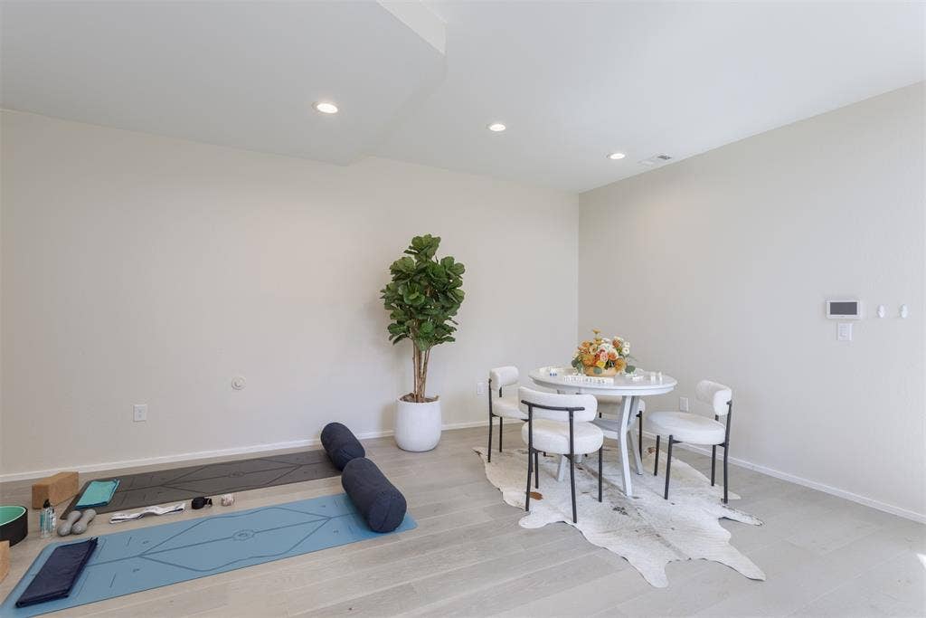 Dining room featuring light wood-style flooring and recessed lighting