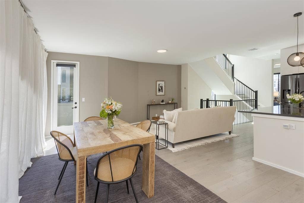 Dining room featuring light wood-style flooring and recessed lighting