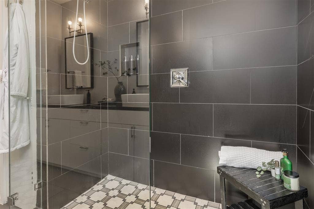 Full bathroom with vanity and a stall shower