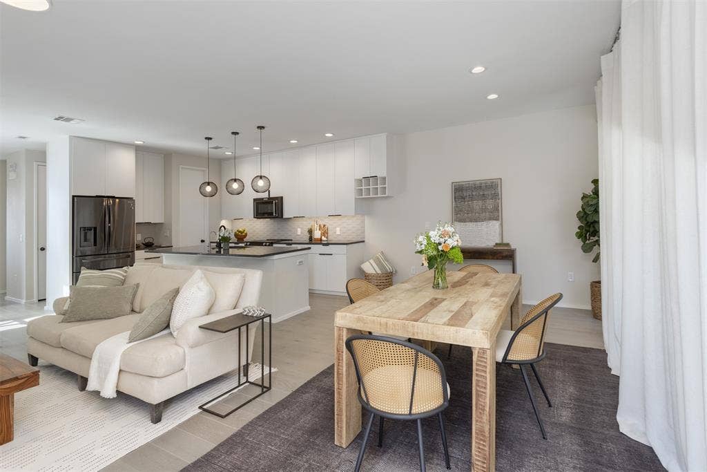 Dining space with recessed lighting and light wood-style floors