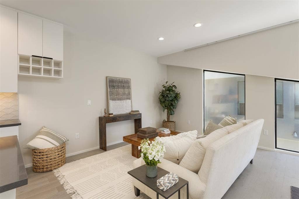 Living room with recessed lighting and light wood-style flooring