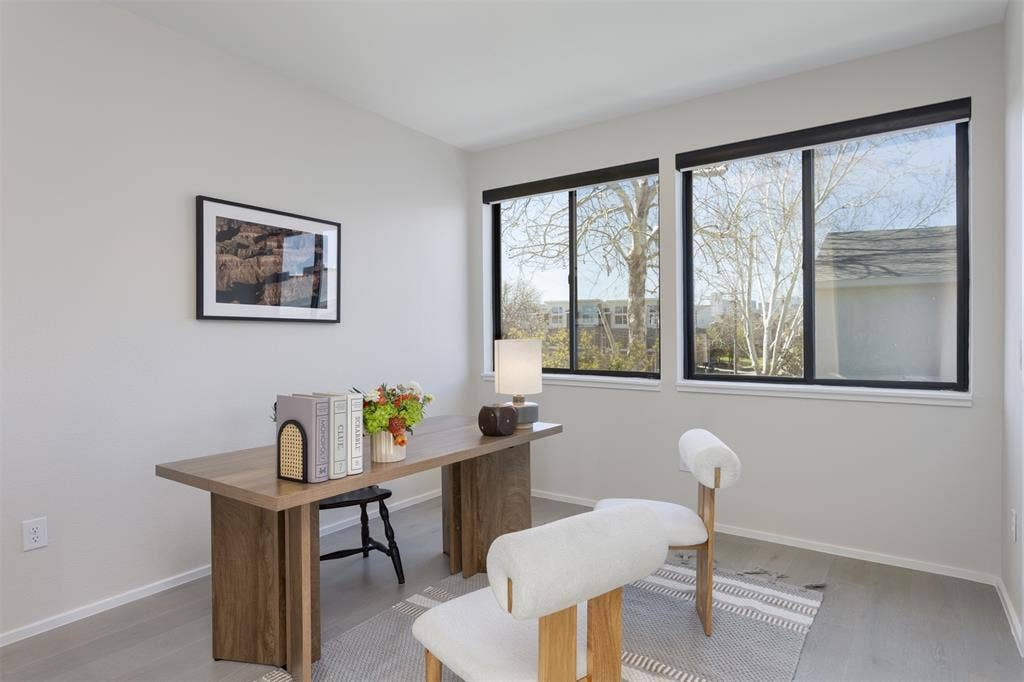Home office featuring baseboards and light wood-style flooring
