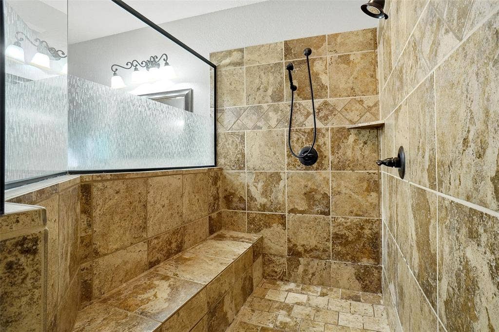 Gorgeous walk-in shower with dual shower heads.