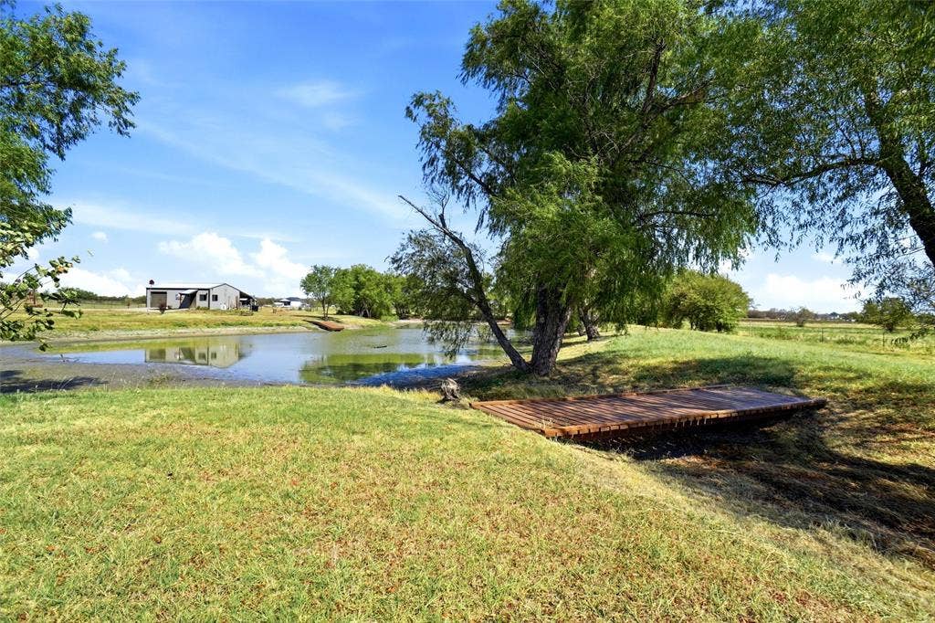 Bridge over pond large enough to drive a zero turn mower over.