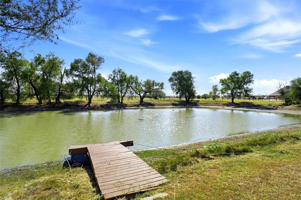 Pond with dock.  With the next rain the pond will be full.