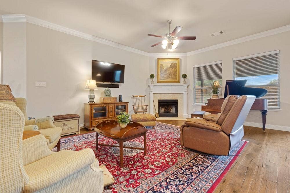 3712 Ann Arbor Lane, Denton, TX 76207 Living room with wood burning fireplace.