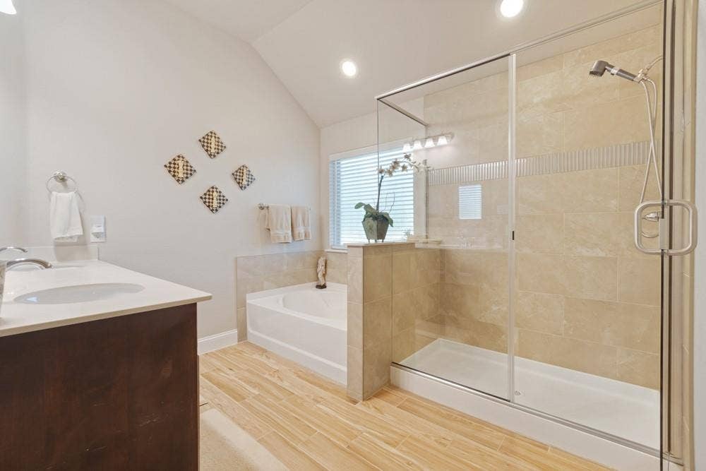 3712 Ann Arbor Lane, Denton, TX 76207 Recently updated primary bathroom with an oversized walk-in shower, separate tub, dual sinks as well as a large walk-in closet you wont want to miss!