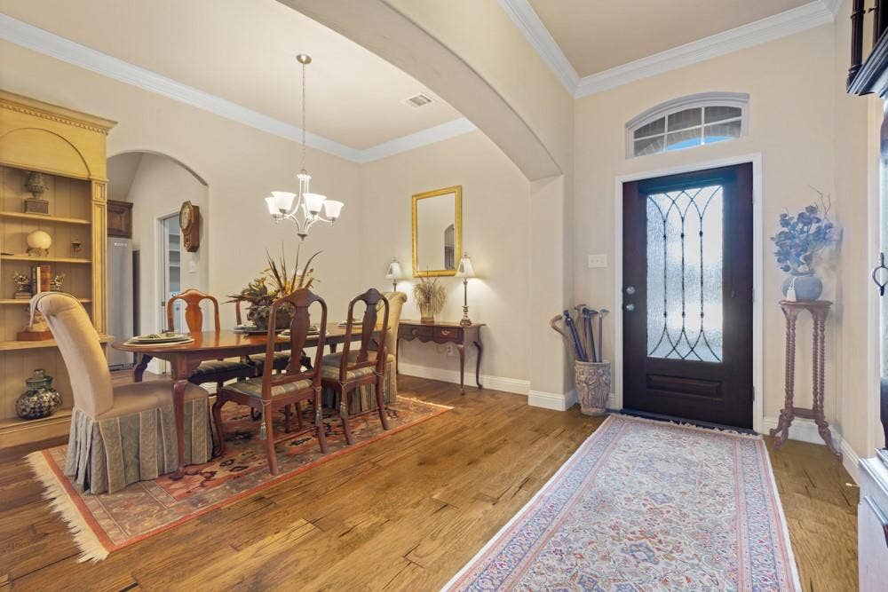 3712 Ann Arbor Lane, Denton, TX 76207 As you walk through the entry, you'll immediately notice the upgrades in this home. Wood flooring, crown molding, 4 in baseboards, 12 ft ceilings and more!