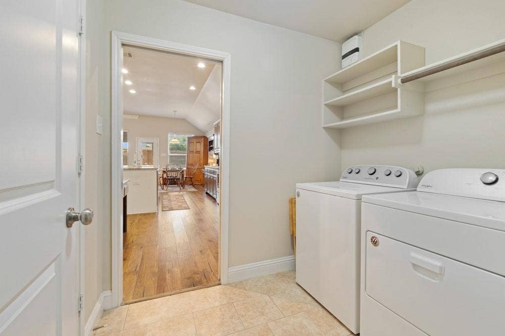 3712 Ann Arbor Lane, Denton, TX 76207 The utility room offers shelving for storage, a hanging bar and a pantry with double doors for ease of access.