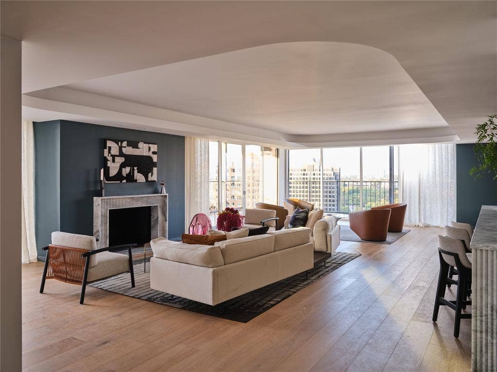 3310 Fairmount Street, #P3B, Dallas, TX 75201 Living room has new floor-to-ceiling windows, LED cove lighting, and wood burning fire place with marble surround.