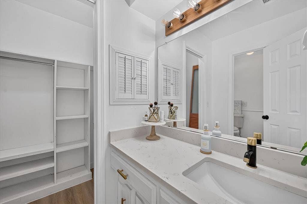 Master bathroom with second closet.