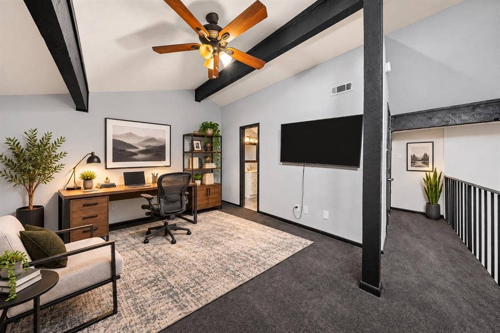 9302 Chimney Sweep Lane, Dallas, TX 75243 Vaulted ceiling with exposed beams, wood-finish ceiling fan, and dark-finish railing