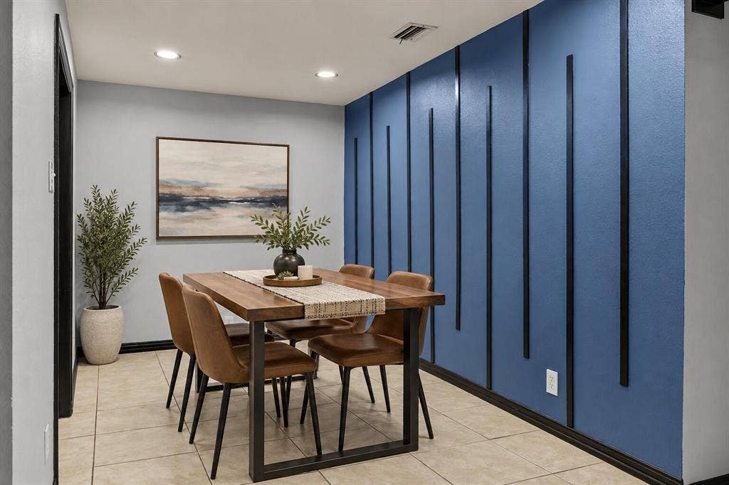 9302 Chimney Sweep Lane, Dallas, TX 75243 Decorative accent wall with vertical trim, recessed lighting, and tile flooring
