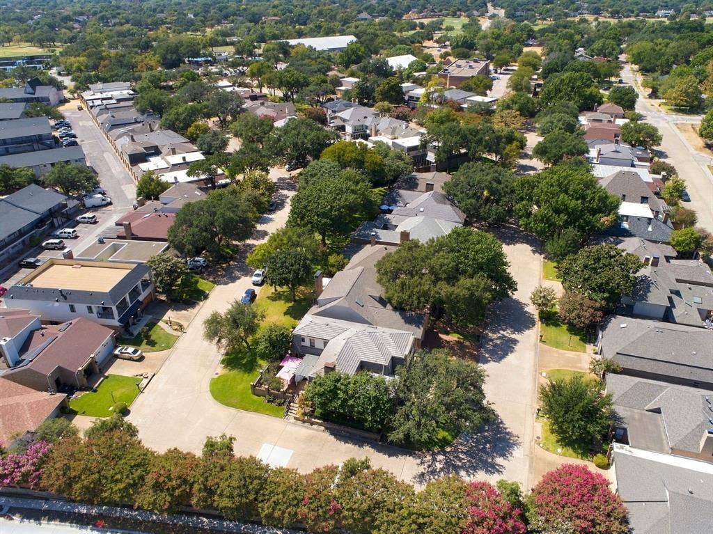 46 Crown Place, Richardson, TX 75080 Aerial perspective of a residential street featuring mature trees and a variety of architectural styles