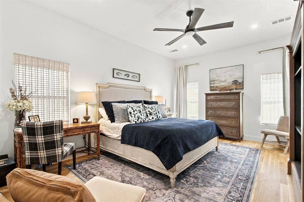 46 Crown Place, Richardson, TX 75080 Recessed lighting, wood-finish flooring, ceiling fan with light, and multiple windows with woven blinds