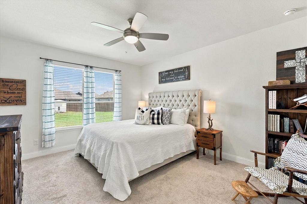 Oversized primary bedroom with California King bed and still room for an additional sitting area