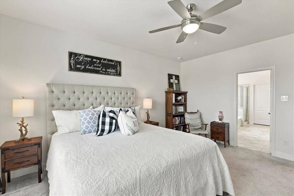 Oversized primary bedroom with California King bed and still room for an additional sitting area