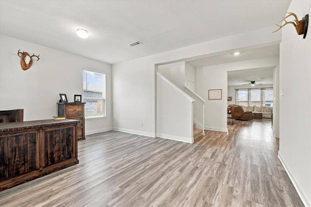Front room currently being used as an office, but could be a dining area, second living room, or many other options.