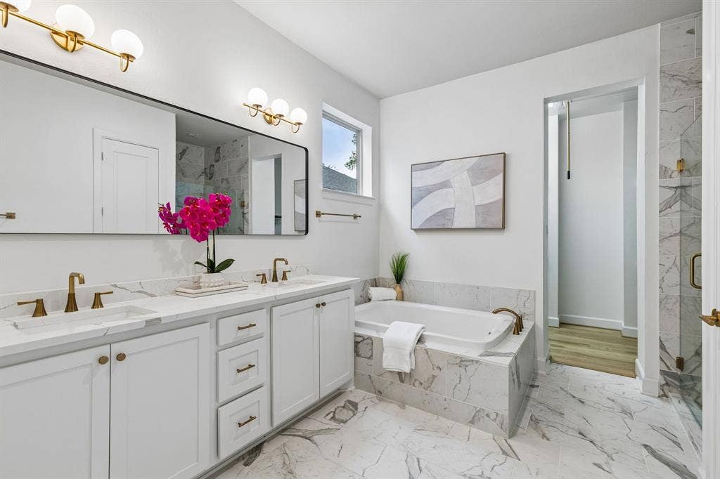 2221 Tremont Boulevard, McKinney, TX 75071 Dual Calacatta quartz vanity with white cabinetry and integrated sinks