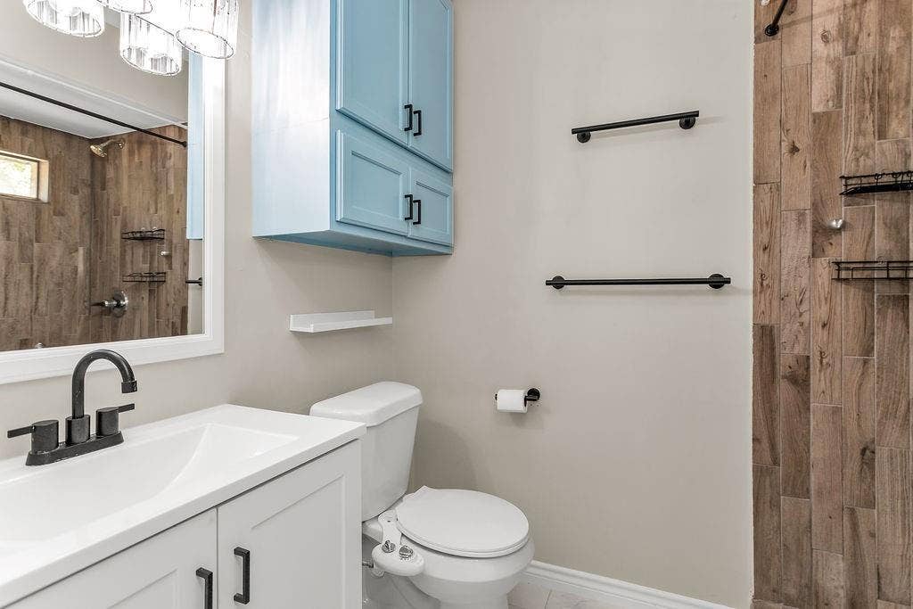 2914 Harvard Street N, Irving, TX 75062 Vanity with single-basin sink and matte black faucet