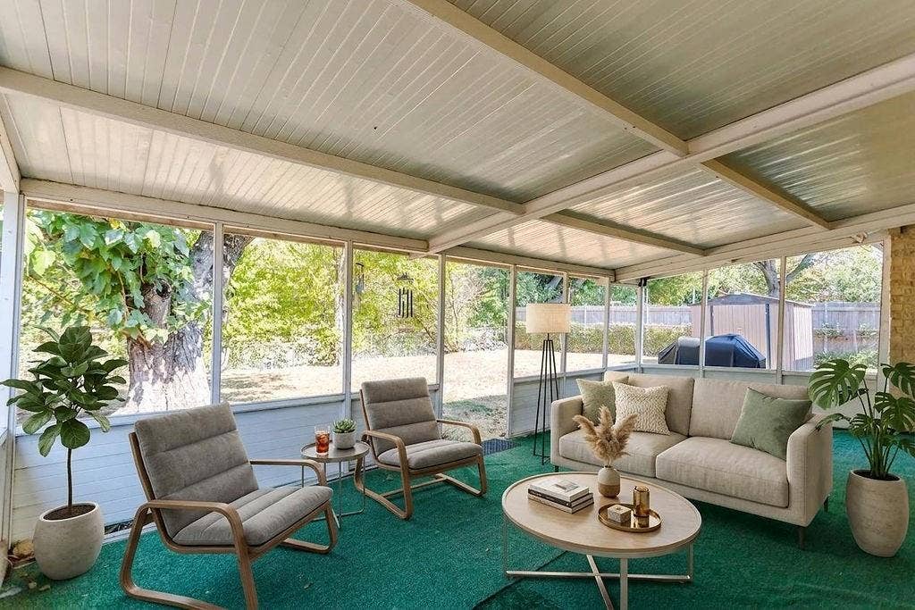 2914 Harvard Street N, Irving, TX 75062 Enclosed sunroom with expansive windows, a white paneled ceiling, and a green floor