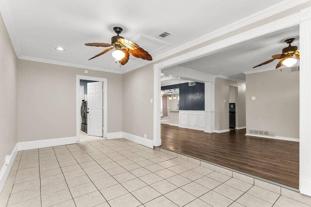 2914 Harvard Street N, Irving, TX 75062 Tile flooring, wood-finish flooring, ceiling fans, crown molding, and recessed lighting