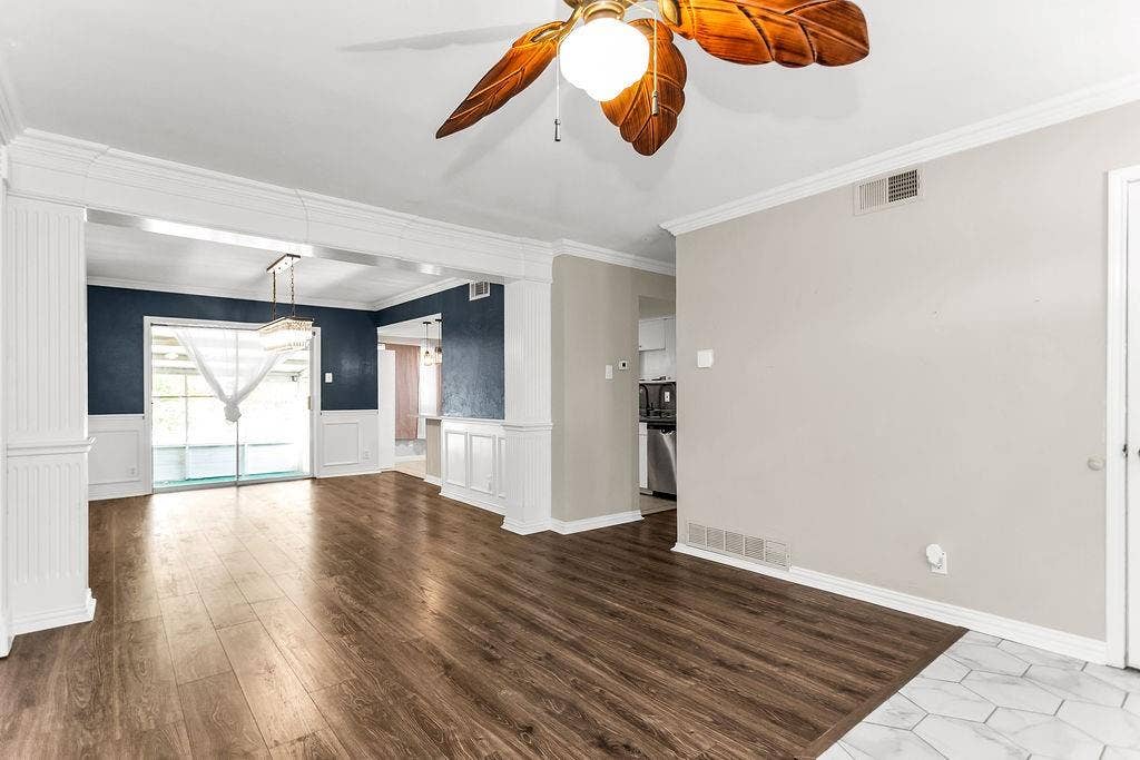2914 Harvard Street N, Irving, TX 75062 Wood-finish flooring, white trim details, ceiling fan, sliding glass door, kitchen visibility