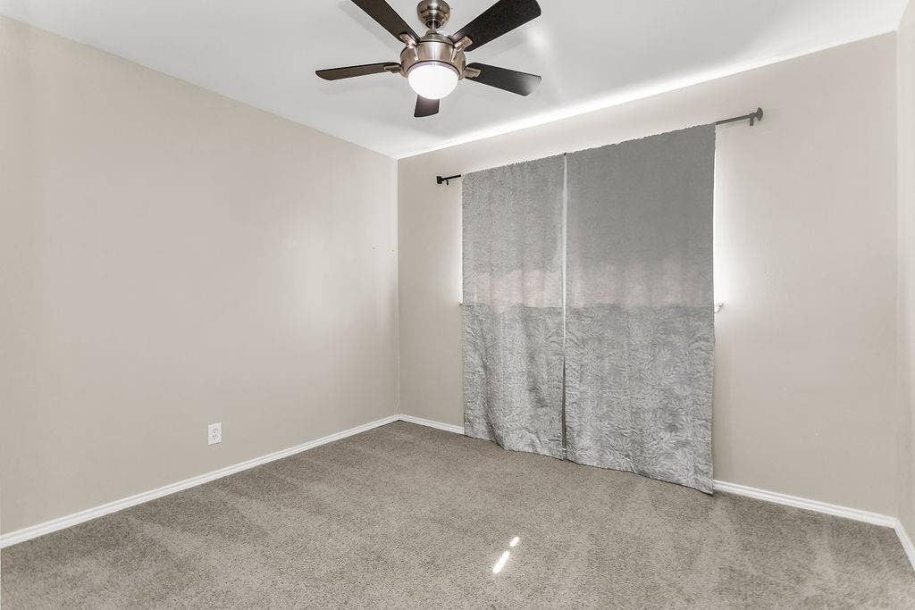 2914 Harvard Street N, Irving, TX 75062 Neutral paint palette with carpeted flooring and white trim