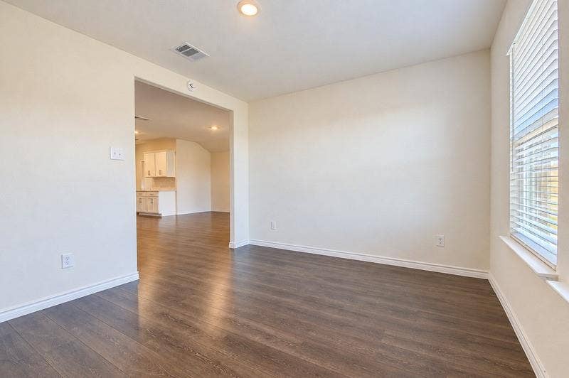 339 Exploration Way, Fate, TX 75189 Wood-finish flooring throughout, recessed ceiling lighting, light-colored wall paint, white trim, and a window with blinds
