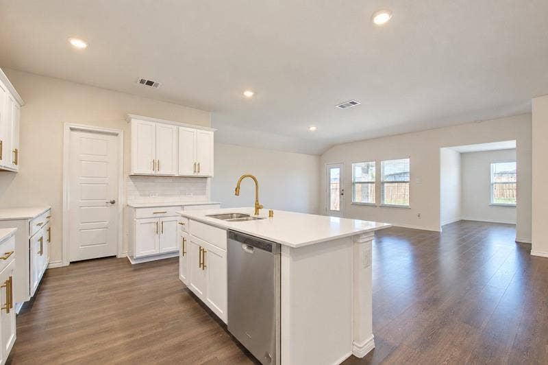 339 Exploration Way, Fate, TX 75189 Kitchen island with an undermount sink, brass finish faucet, and an integrated dishwasher