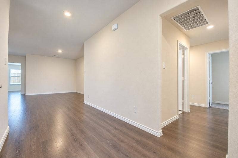 339 Exploration Way, Fate, TX 75189 Wood-finish flooring throughout, recessed lighting, and crisp white trim