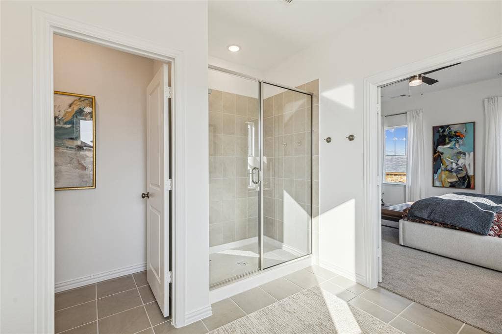 9735 Speaker Drive, Frisco, TX 75035 You'll enjoy a spa like experience every day in this spacious step in shower.