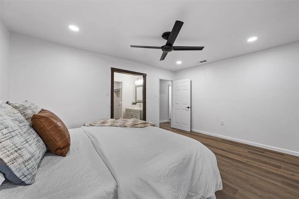 1132 Western Oaks Drive, Woodway, TX 76712 Wood-finish flooring, recessed lighting, and a dark-toned ceiling fan