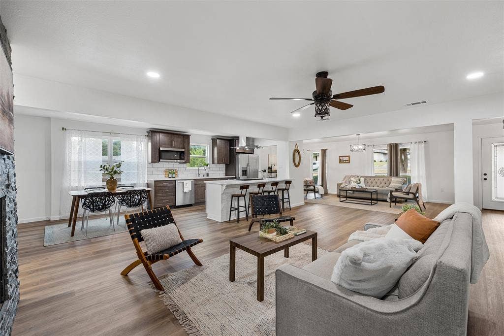 1132 Western Oaks Drive, Woodway, TX 76712 Open-concept living space featuring wood-finish flooring, recessed lighting, and a ceiling fan