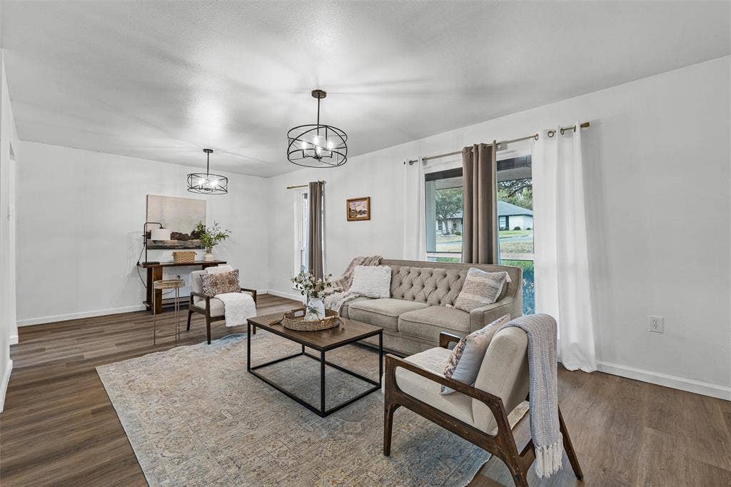 1132 Western Oaks Drive, Woodway, TX 76712 White walls, wood-finish flooring, and two windows with outdoor views