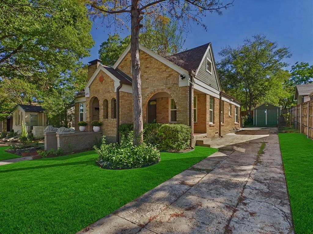 510 S Westmoreland Road, Dallas, TX 75211 Brick exterior with arched entryways, gabled roofline, and established landscaping