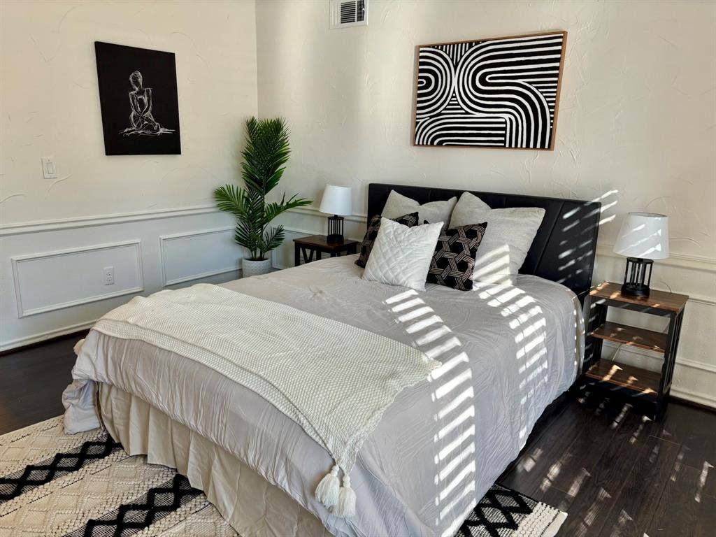 3713 San Juan Circle, Plano, TX 75023 Dark wood-finish flooring, white paneled wainscoting, and textured wall finish