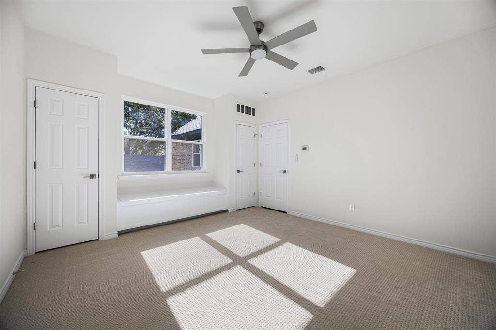 5901 Glen Heather Drive, Plano, TX 75093 Spacious secondary bedroom features lots of storage with multiple closets, and a built-in window seat beneath a large window that brings abundant daylight into the room.