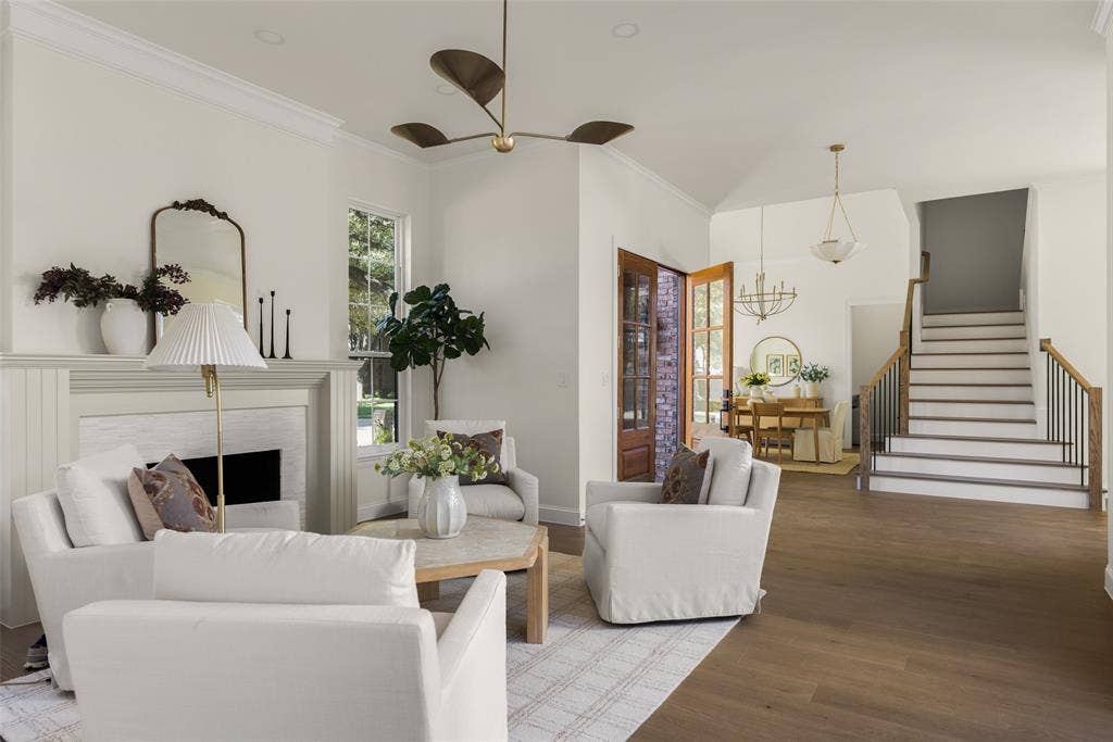 5901 Glen Heather Drive, Plano, TX 75093 Open floor plan with livable flow, connects the front living room with the entry, staircase, and formal dining area while maintaining clearly defined spaces.