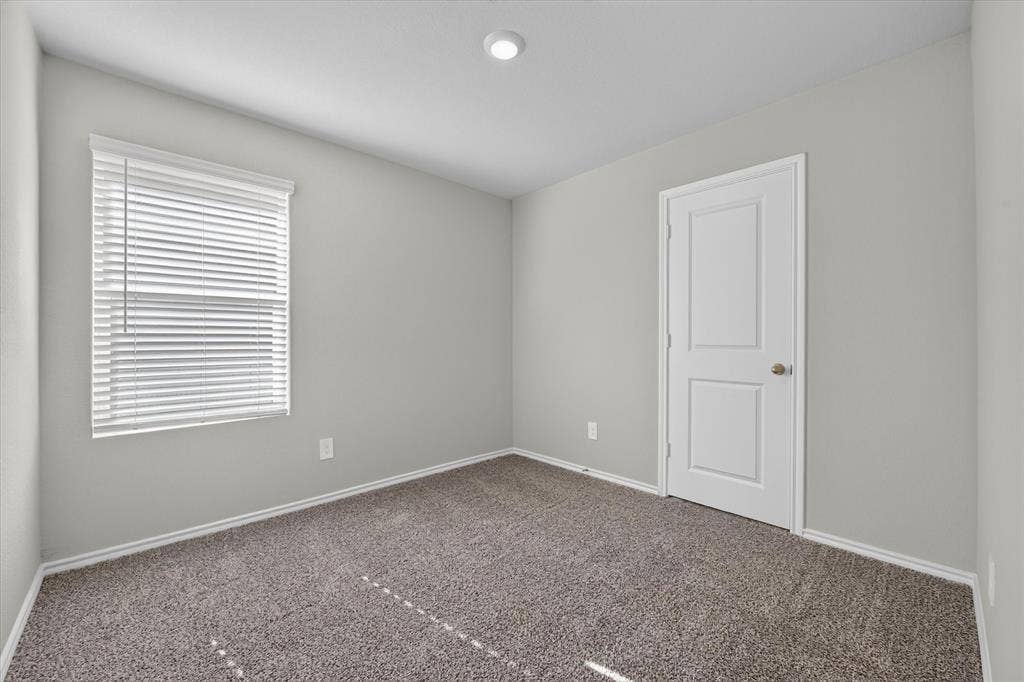 5413 Flannel Lane, Denton, TX 76249 Recessed ceiling light, paneled door, window with blinds, and carpeted flooring