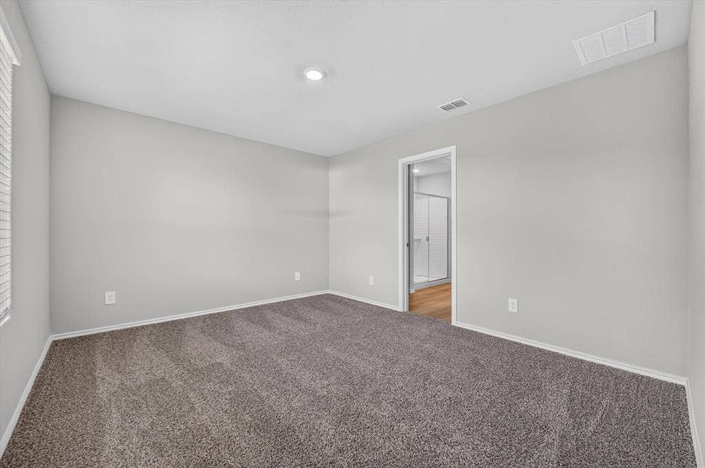 5413 Flannel Lane, Denton, TX 76249 Vaulted ceiling room with recessed lighting and neutral gray walls