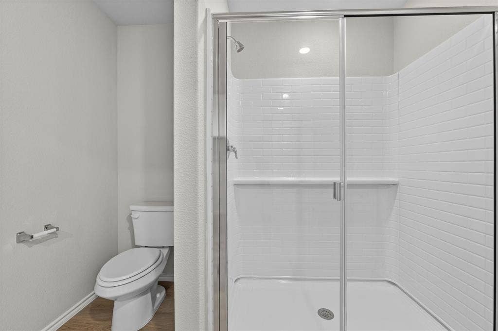 5413 Flannel Lane, Denton, TX 76249 Shower with subway tile surround, clear glass enclosure, and recessed lighting