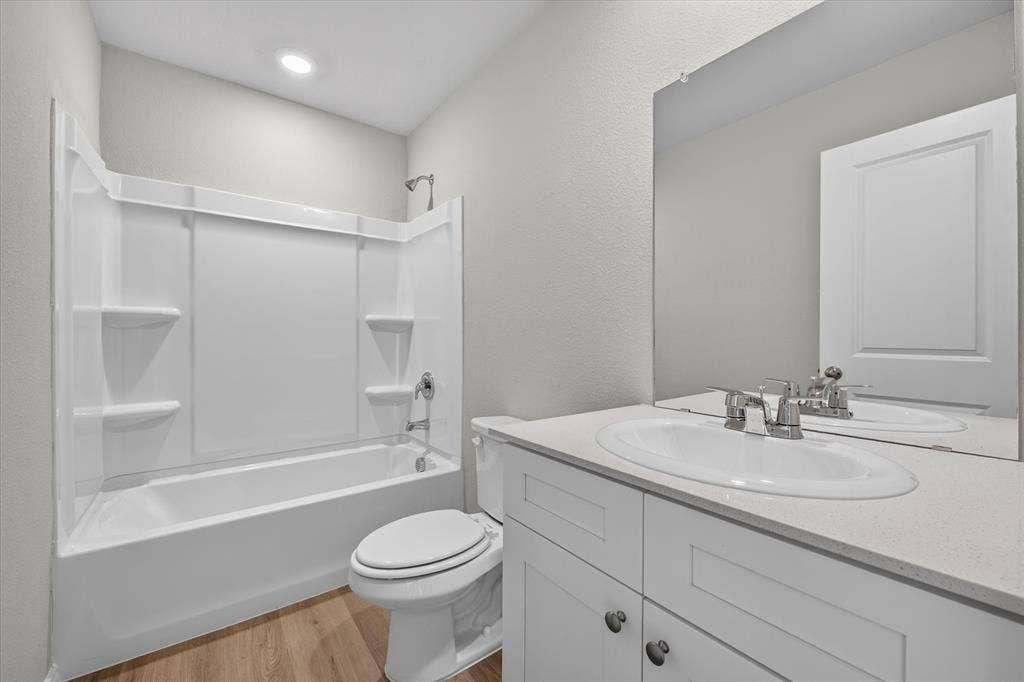 5413 Flannel Lane, Denton, TX 76249 White vanity with a light countertop, undersink cabinetry, and a chrome faucet